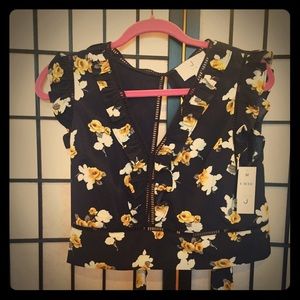Navy floral crop top, open back.